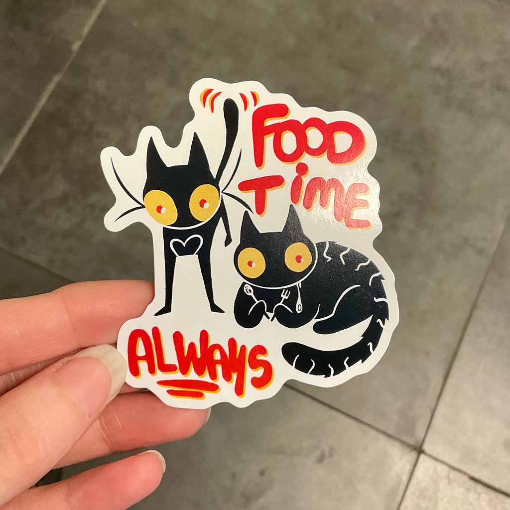 Two cats with the words FOOD TIME ALWAYS around them.